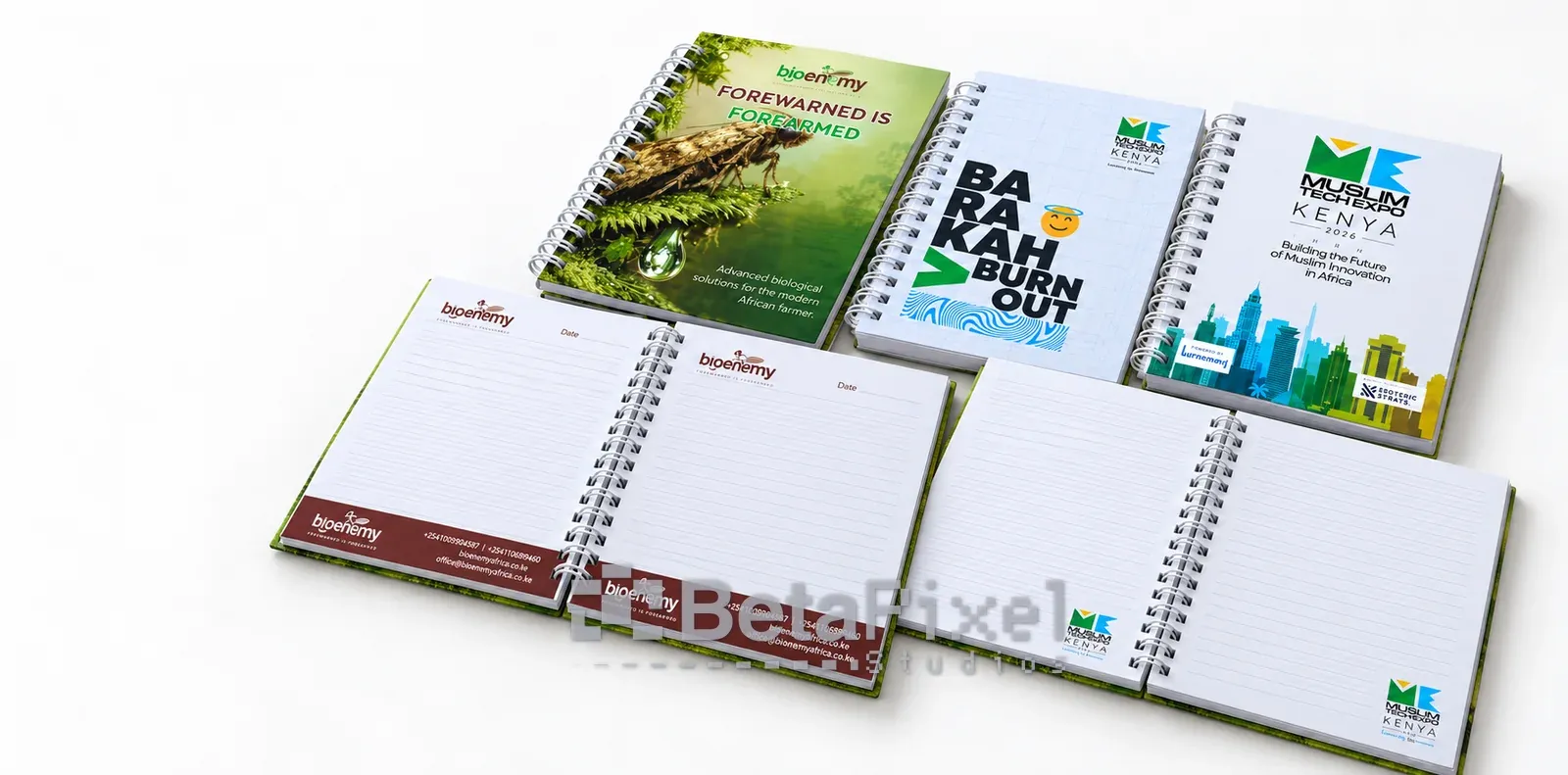 Custom spiral notebooks with full-colour printed covers and branded inner pages for a company and a tech conference