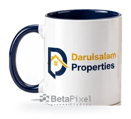 White ceramic mug with a navy handle and interior, printed with a full-colour company logo