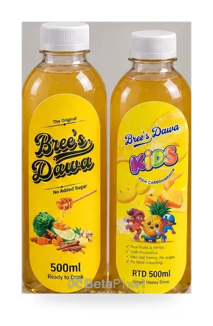 Bright yellow labels on two 500 ml ginger and honey drink bottles, one designed for children