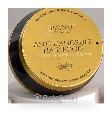 Round gold label on the lid of an anti-dandruff hair food jar