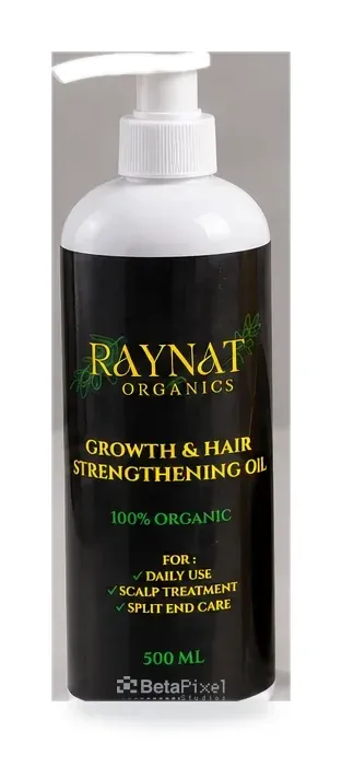 Black and gold label on a 500 ml pump bottle of organic hair growth oil