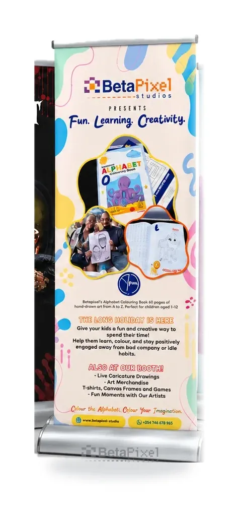 Colourful roll-up banner promoting the Betapixel Alphabet Colouring Book at a holiday event