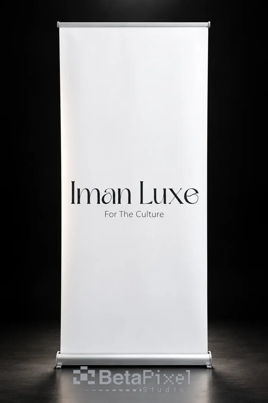 Minimal white roll-up banner on a silver stand with an elegant fashion brand wordmark and tagline