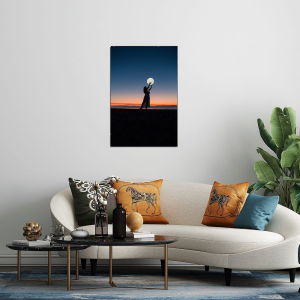 Lady holding the moon in a beautiful evening background